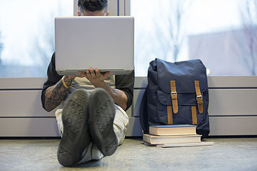 Youth working on laptop computer